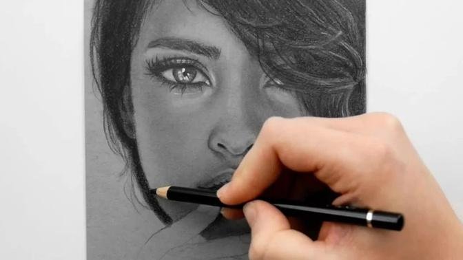 Drawing a portrait with Graphite pencils on grey toned paper