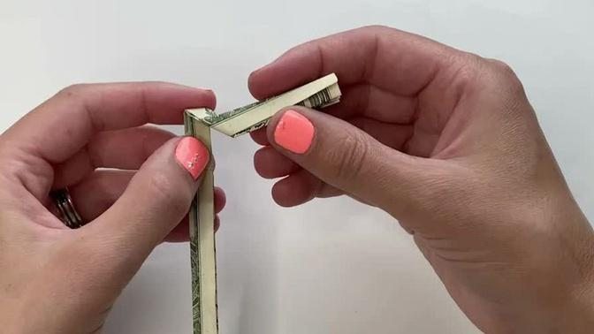 Making a cross out of a dollar bill