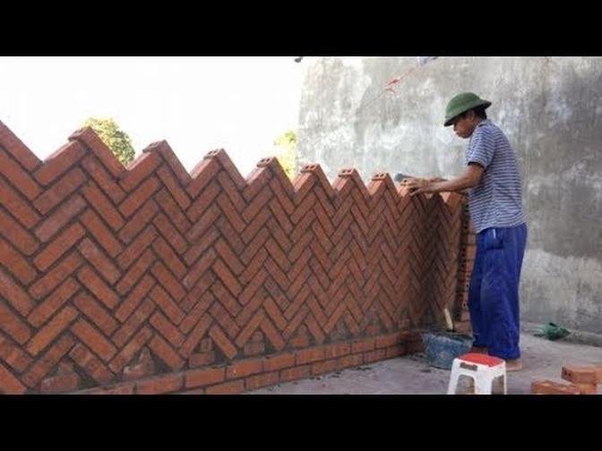 Innovative Construction Techniques From Bricks And Cement - Workers Build Protective Barriers