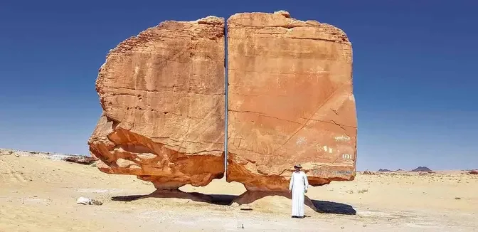 The Al Naslaa rock formation in Saudi Arabia features a perfect vertical slice that scientists can only theorize as to its origins. (<a href="https://commons.wikimedia.org/wiki/File:Al_Naslaa_Rock_20211021_105005.jpg">Disdero</a>/<a href="https://creativecommons.org/licenses/by-sa/4.0/deed.en">CC BY-SA 4.0 DEED</a>)